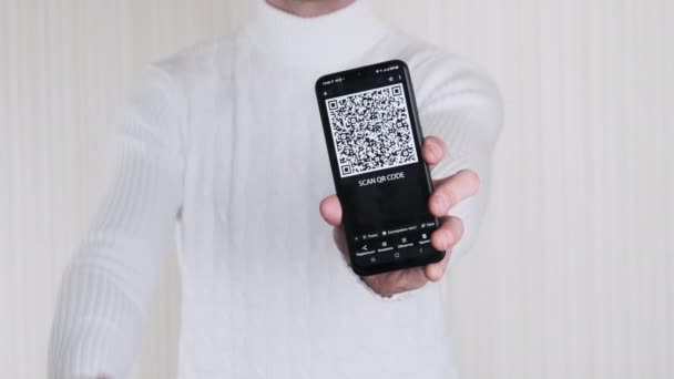 Man Shows Code Smartphone Shows Thumbs Sign White Background Inscription — ストック動画