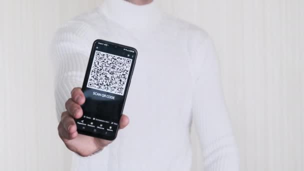 Man Shows Code Smartphone Shows Thumbs Sign White Background Inscription — Stock Video