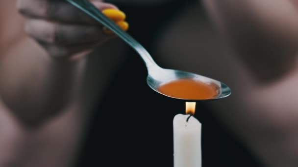 Woman Drug Addict Cooking Drugs Spoon Candle Flame Warming Narcotic — Stockvideo