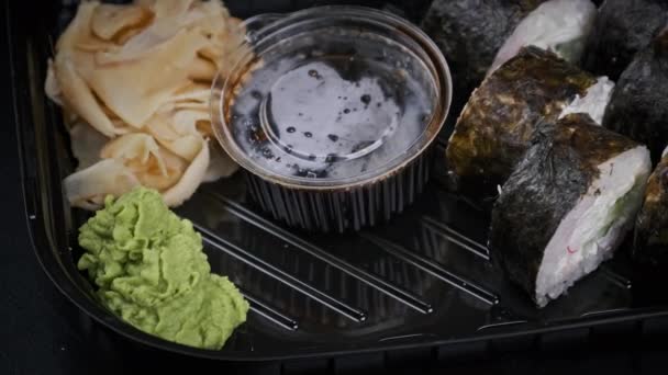 Japanese Sushi Rolls Plastic Box Rotating Close Takeaway Fresh Sushi — Video Stock