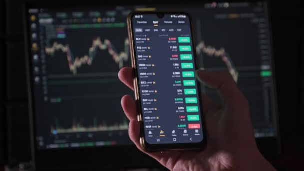 Investor Checking Cryptocurrency Price Smartphone Screen Many Crypto Assets Show — Stockvideo