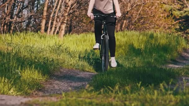 Young Woman Bicycle Rides Green Forest Path Sunny Summer Day — Video Stock