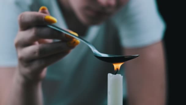 Woman Drug Addict Cooking Drugs Spoon Candle Flame Warming Narcotic — Stockvideo