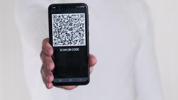 Male Hand Shows Code Smartphone White Background Inscription Mobile Phone — Stock video