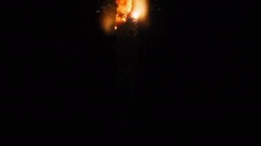 Sparkler on the black background in slow motion, macro shot. Lightening sparkler concept. Bengal light is burning in dark. Close-up of firework sparkler burning. Gun powder sparks shot.