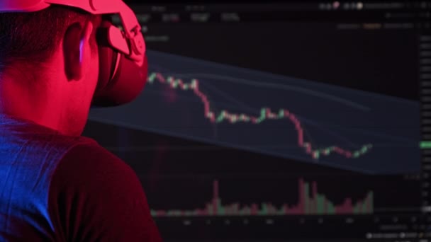 Trader Virtual Reality Helmet Looks Cryptocurrency Charts Young Man Analyzes — Vídeos de Stock