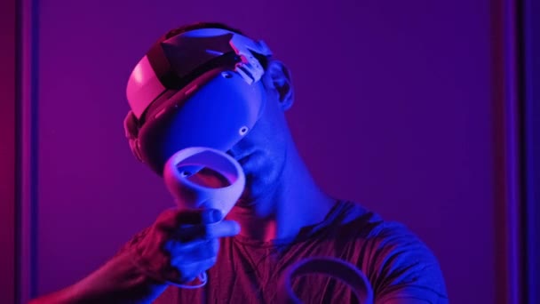 Young Man Helmet Interacts Virtual Reality Using Controllers Male Plays — Vídeos de Stock