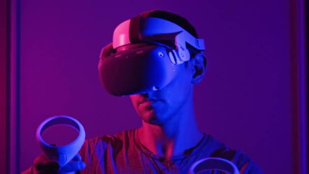 Young Man Helmet Interacts Virtual Reality Using Controllers Male Plays — Video
