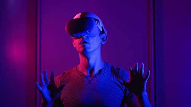 Young Man Helmet Interacts Virtual Reality Using His Hands Male — Stock Video