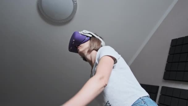 Young Woman Virtual Reality Headset Plays Game Home Emotional Female — Stockvideo