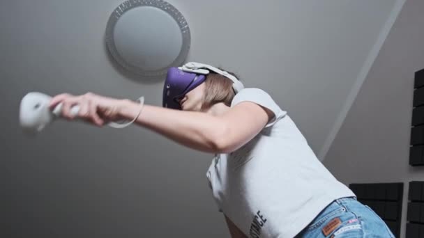 Young Woman Virtual Reality Headset Plays Game Home Emotional Female — Stockvideo