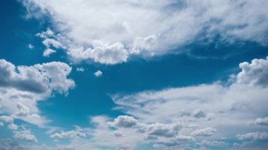 Timelapse of layered clouds moving in the blue sky. Cumulus light clouds change shape in cloud space. Awesome sky. Fluffy white clouds, time-lapse. Copy space. Change of weather. Nature background 4K