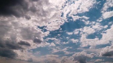 Timelapse of layered clouds moving in the blue sky. Cumulus light clouds change shape in cloud space. Awesome sky. Fluffy white clouds, time-lapse. Copy space. Change of weather. Nature background 4K
