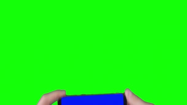 Male Hand Holding Smartphone Blue Screen Trackers Green Background Chroma — стоковое видео