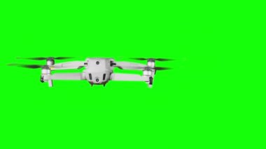 Real quadcopter with camera flights on a green screen. A drone hovering in the air with an alpha channel. Isolated portable copter on alpha matte. Aircraft blades rotate in hanging. Alpha channel 4K