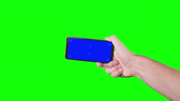 Male Hand Holding Smartphone Blue Screen Trackers Green Background Chroma — Αρχείο Βίντεο