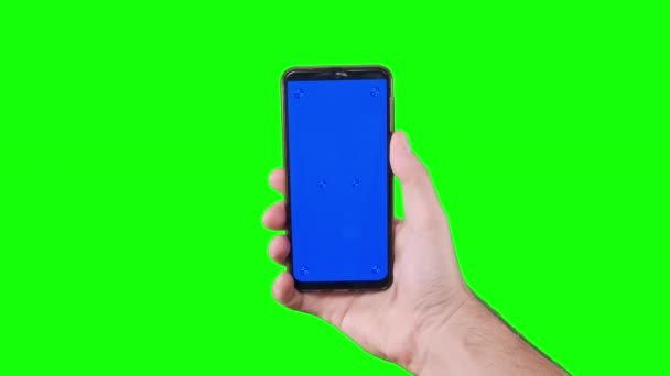 Male Hand Holding Smartphone Blue Screen Trackers Green Background Chroma — Stockvideo