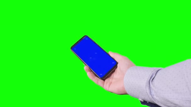 Male Hand Holding Smartphone Blue Screen Trackers Green Background Chroma — Stockvideo