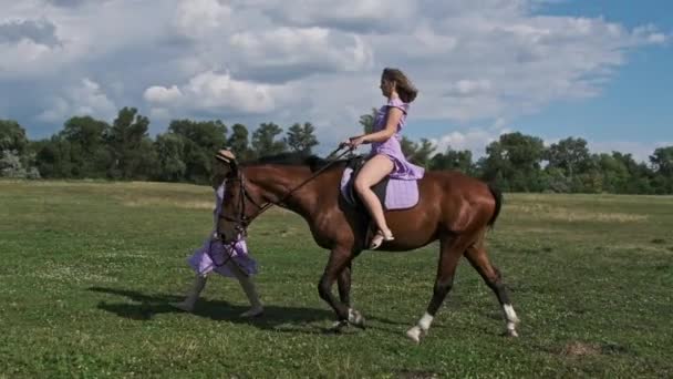 Two Twin Girls Purple Summer Dresses Straw Hats One Rides — Stock Video