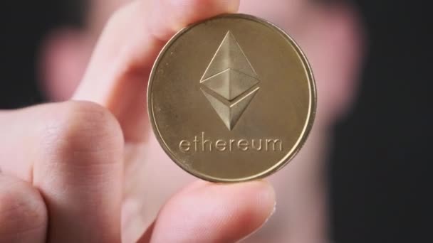 Ethereum Coin Close Mans Hand Shows Eth Golden Crypto Coin — Stock Video