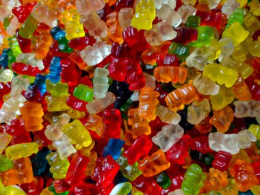 Farklı şekillerdeki çok renkli çiğneme şekerlemelerinin arka planı