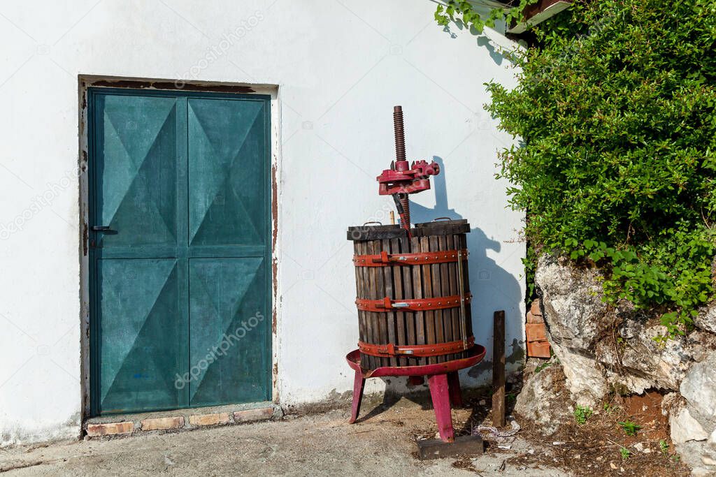 Entrance to the winery and equipment for pressing grape juice