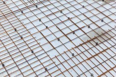 Rebar metal frame. Steel mesh interconnected at the construction site. Construction of multi-storey frame houses