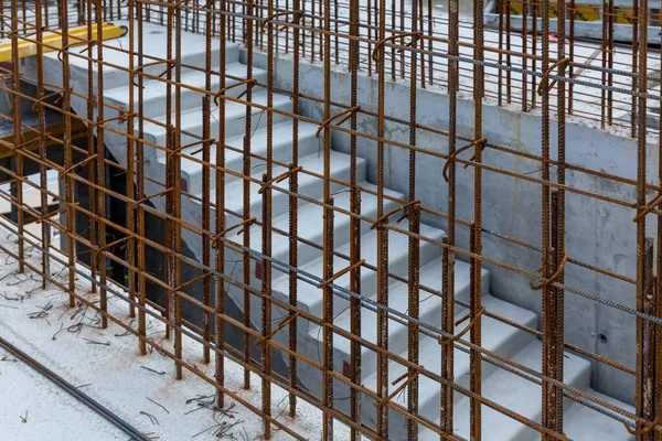 Rebar metal frame. Steel mesh interconnected at the construction site. Construction of multi-storey frame houses