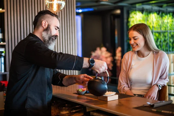 Sushi Master Serving Sushi Meal Cheerful Young Woman Sushi Restaurant — Stock Photo, Image