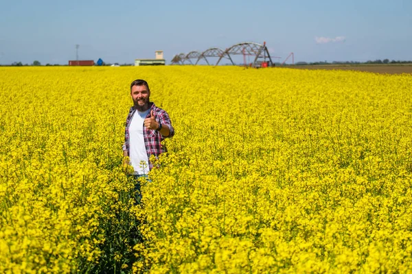 Portrait Happy Successful Farmer Who Standing His Rapeseed Field Rapeseed — Foto Stock