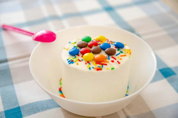 Ice-cream with decor on the white plate