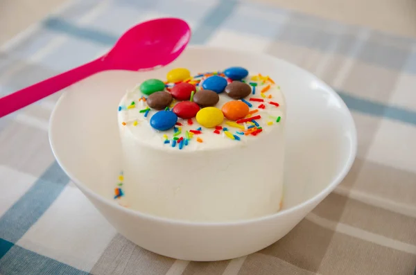 Ice-cream with decor on the white plate