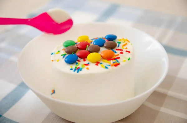 Ice-cream with decor on the white plate