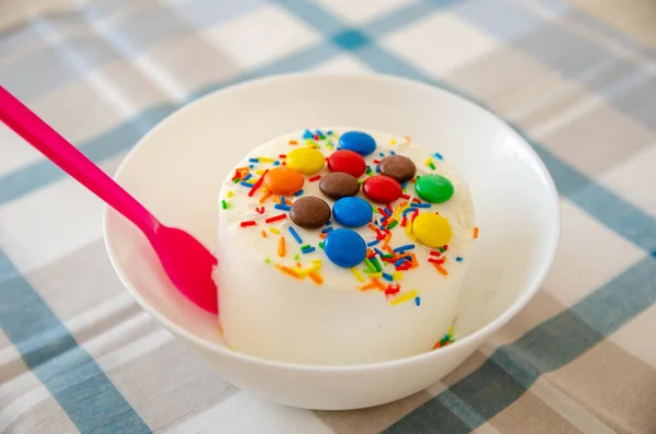 Ice-cream with decor on the white plate