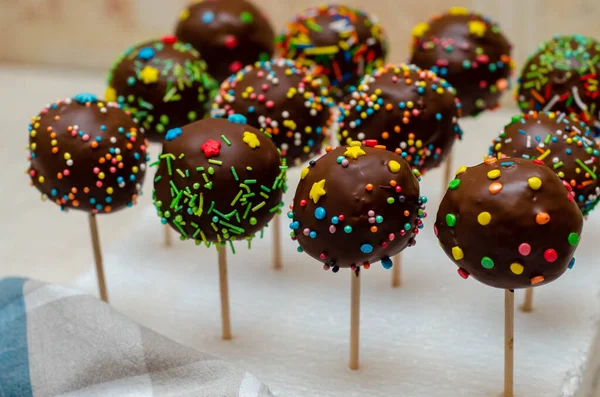 colorful tasty sweet cupcakes with sprinkles, close up shot