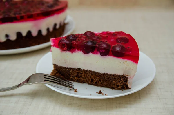 close up of a slice of cake on wooden background with copy space.