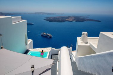Beautiful white architecture of Santorini island, summer landscape with blue sky, sea and caldera view, outdoor travel background, Imerovigli, Greece