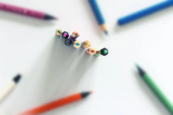 Coloured crayons on white background