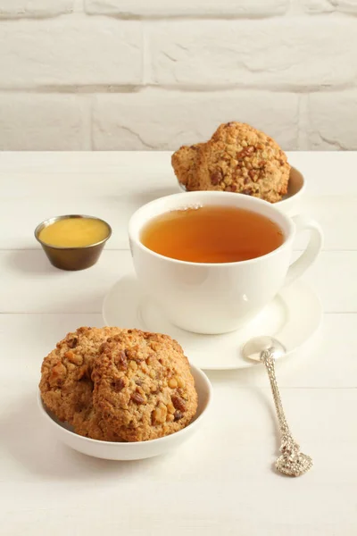 Oatmeal Cookies Walnuts Raisins Small Saucers Cup Green Tea Standing — Stock Photo, Image