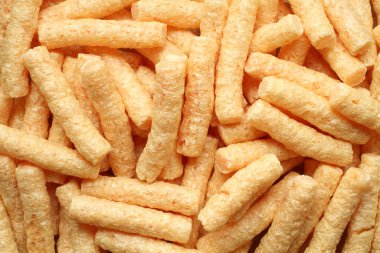 Pile of corn sticks with beetroot. Top down view. Closeup.