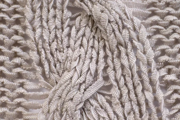 ニットウール繊維素材の背景の柔らかい軽い自然な質感 白いかぎ針編みの綿織物キャンバスの質感を閉じます — ストック写真