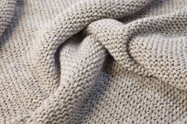 Yumuşak, hafif, doğal, yün kumaş kaplama. Beyaz örgü, pamuk, kumaş, kumaş, tuval dokusu. Kapatın.