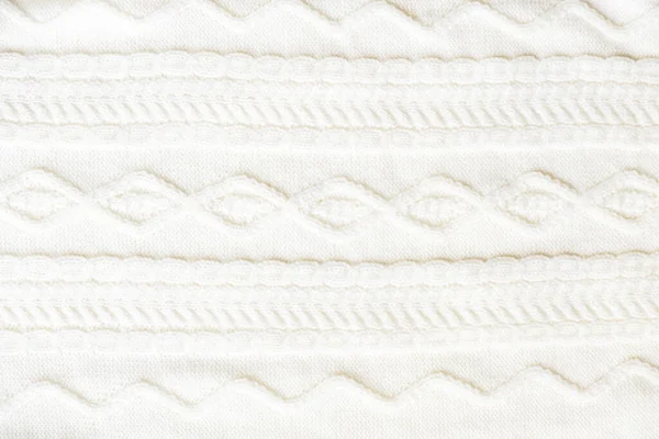 Cable knitting stitch pattern, soft woolen texture, handmade knitted cloth.Huggy style — Stockfoto