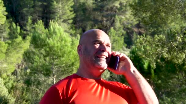 Slow Motion Man Speaks Phone Forest — Stockvideo