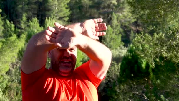 Slow Motion Man Asks Help Forest Opening Closing His Arms — Stockvideo