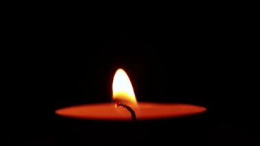 Candle lit in the room at night