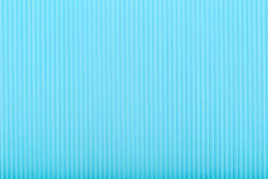 Küçük dikey çizgileri olan soyut mavi arkaplan. Oluklu kâğıt kapanıyor. Kopyalama alanı olan desenli arkaplan