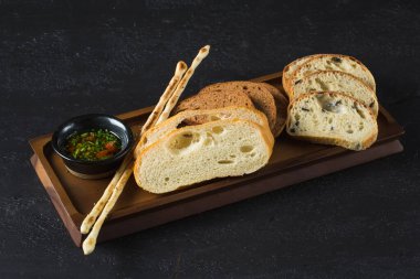 bread slicing ciabatta, malt bread and grissini