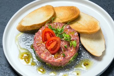 Fresh Tartare dish with tomatoes on a plate