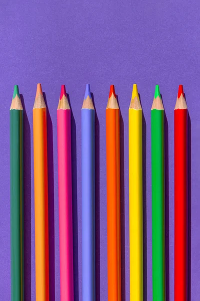 Set Colorful Wooden Pencils Violet Background Minimal Style Top View — Stockfoto